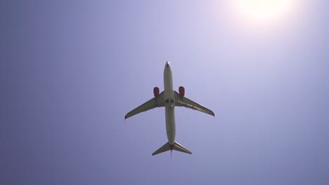 an airplane takes off up into the sky from a landing strip