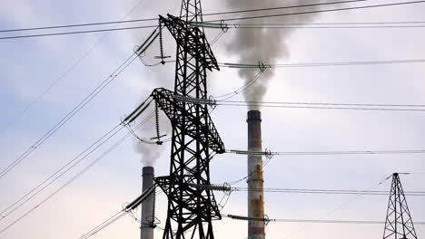 ecological problems. transmission lines near the industry. thick smoke from pipes filling the air. chemical fumes pollute the atmosphere.