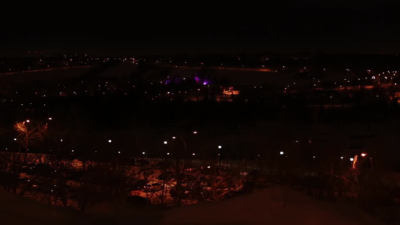 A slow pan across Edmonton's downtown river valley on a winter evening