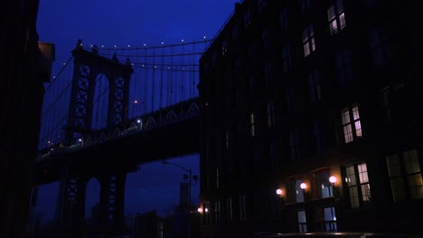 a nice view of a brooklyn new york street with the bridge background and apartments foreground 2