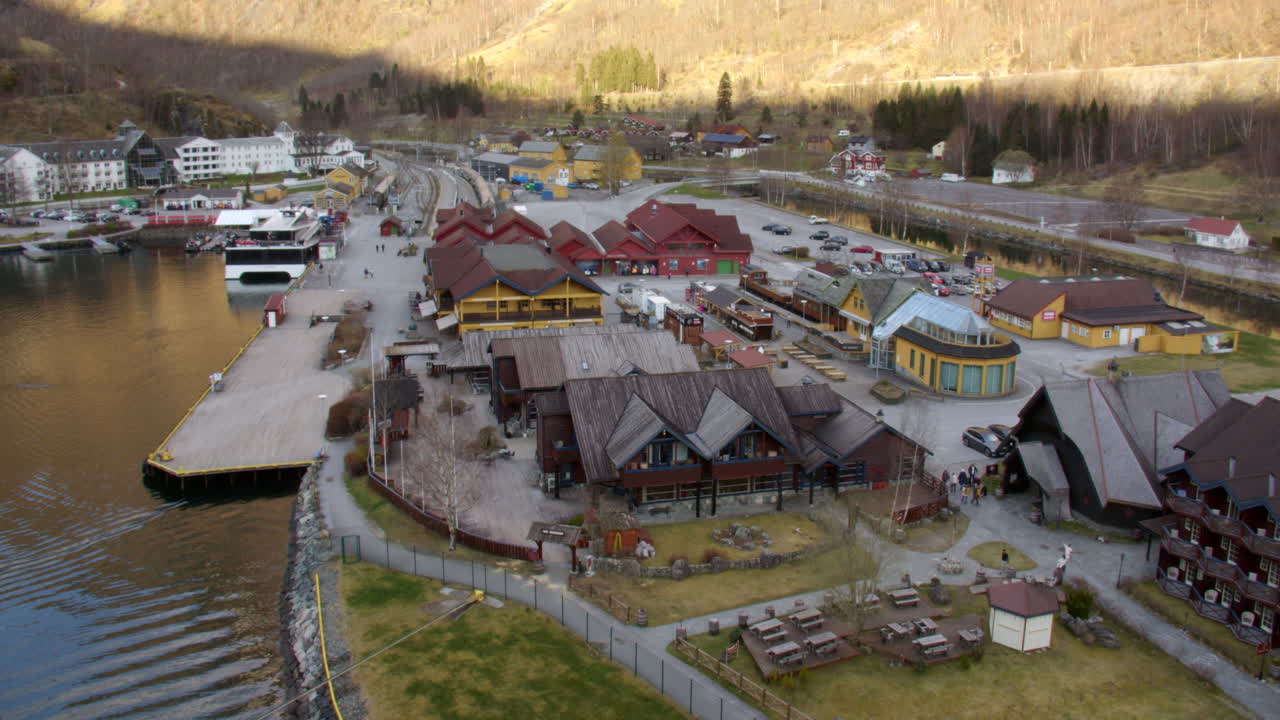 Extra wide shot of Village of flam and its railway station and harbour