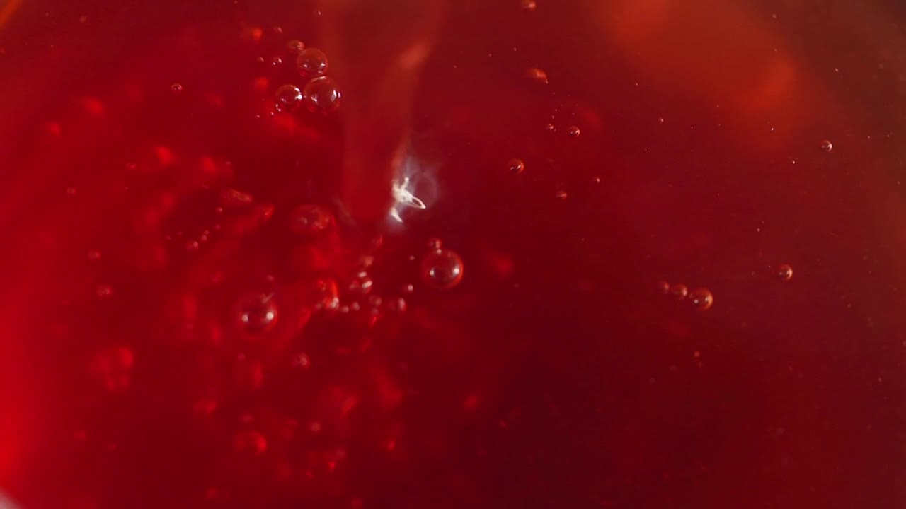 Close-up of Red Liquid with Bubbles