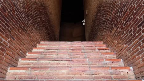 ascending brick stairs to a temple altar