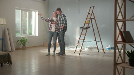 couple planning home renovation with tablet