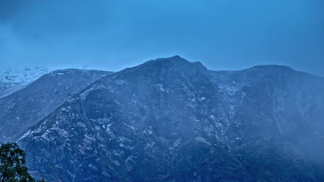 timelapse of mountain landscape shrouded in morning fog