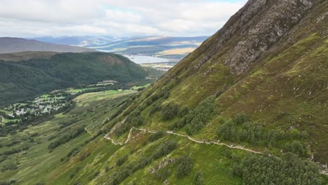 4K-Aerial-drone-shot-descending-down-path-way-leading-to-Ben-Nevis