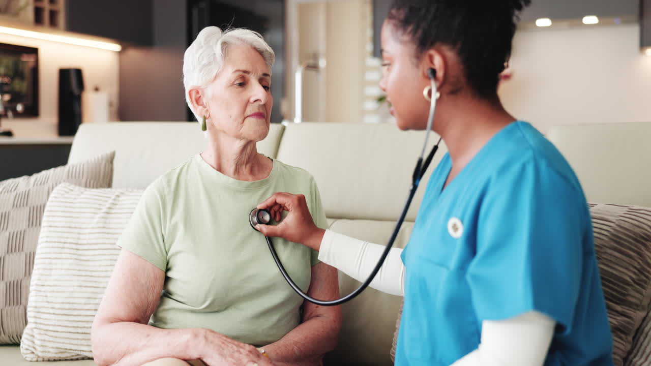 Healthcare Professional Examining Senior Woman with Stethoscope at Home