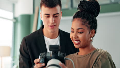photographers reviewing photos on camera