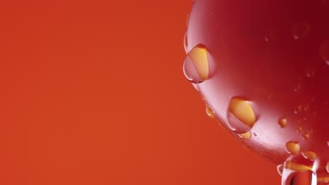 water droplets on a red tomato