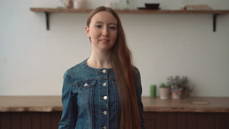 portrait of happy woman looking at camera posing indoors at home