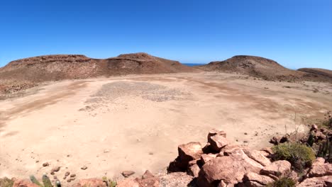 a large open desert area in the foothills of isla espiritu santo between two bodies of water