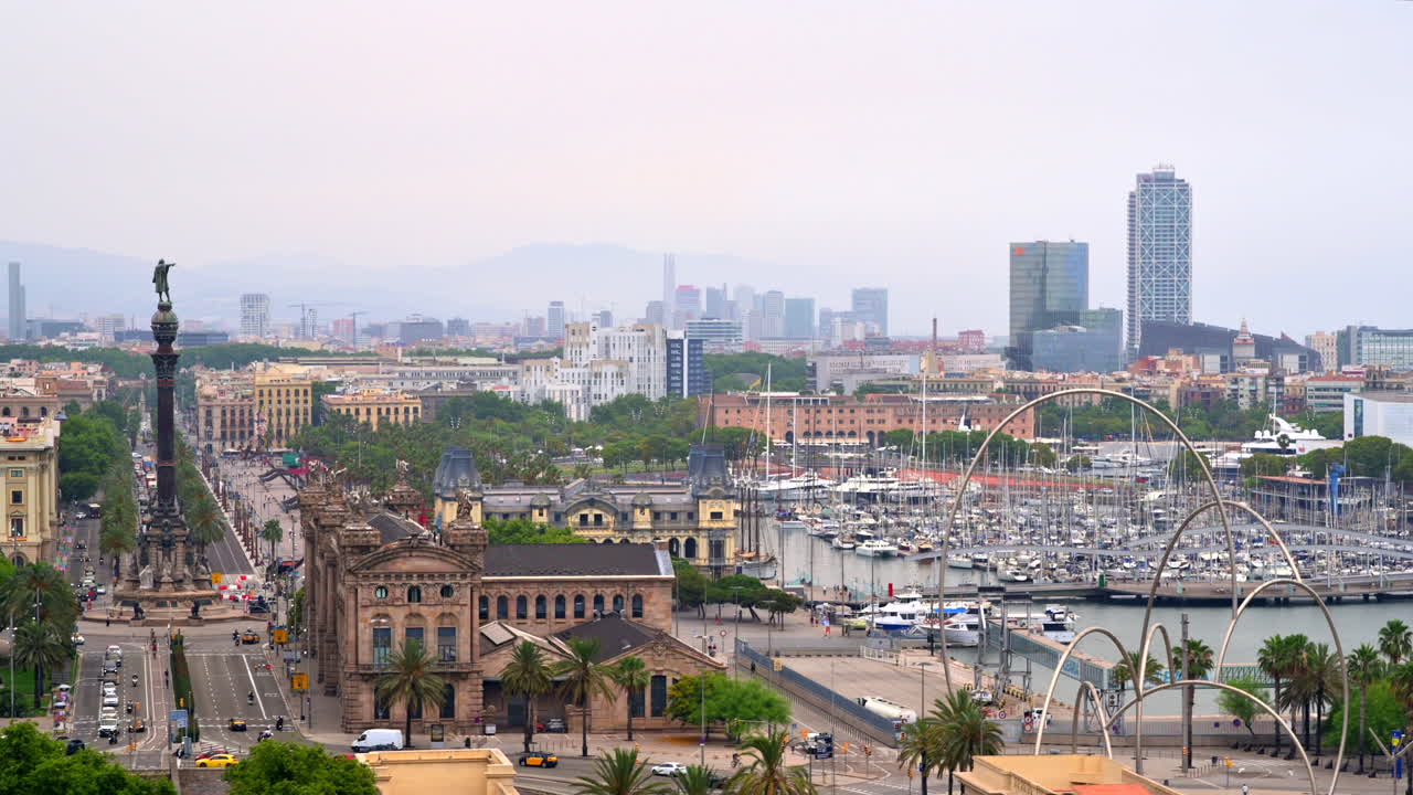 Aerial drone view of the Port Vell, the Columbus Monument and the Junta d'Obres del Port building in Barcelona, Spain