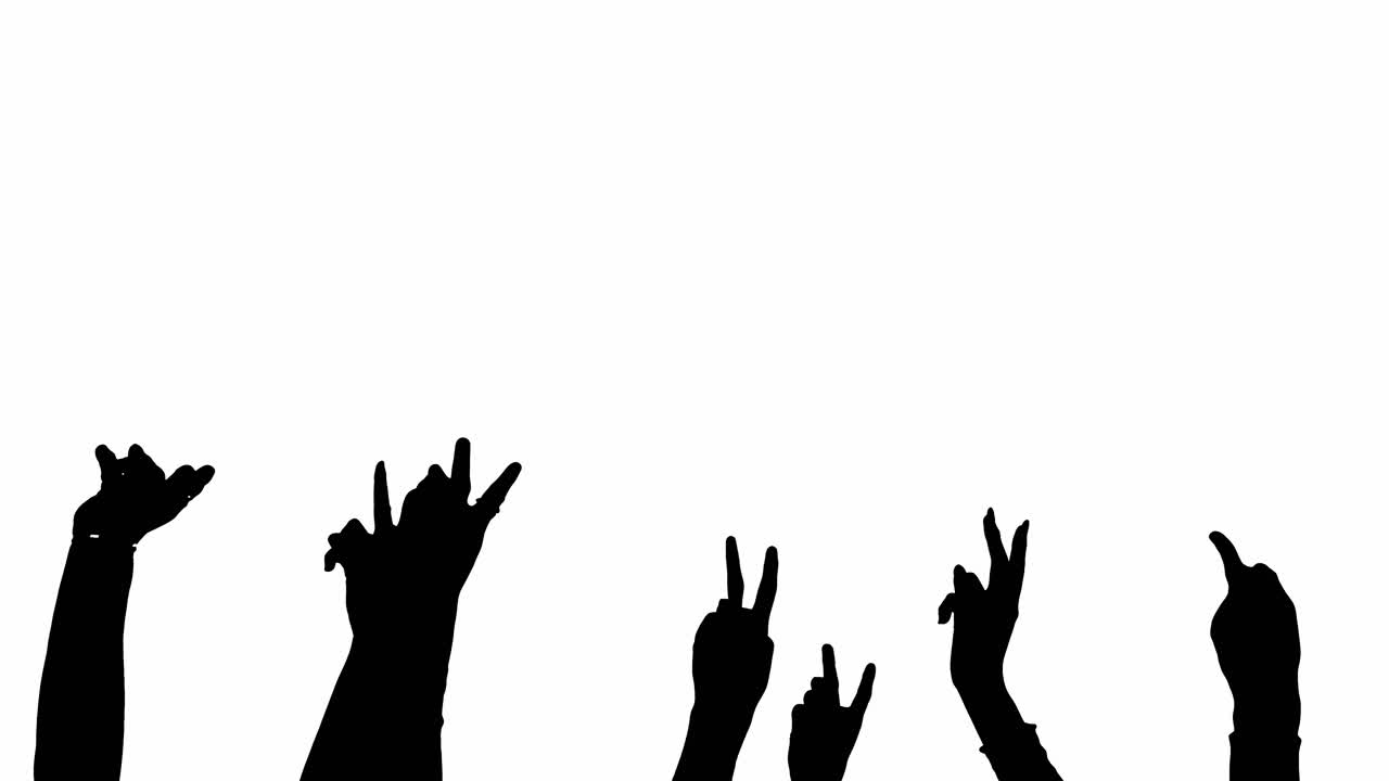 Silhouetted Hands Raised in Celebration