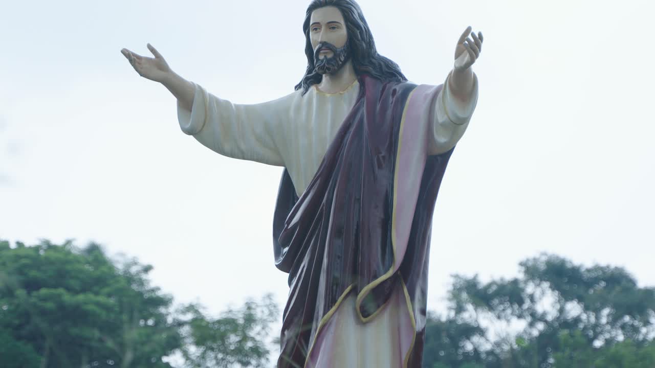 Jesus Christ with his arms raised