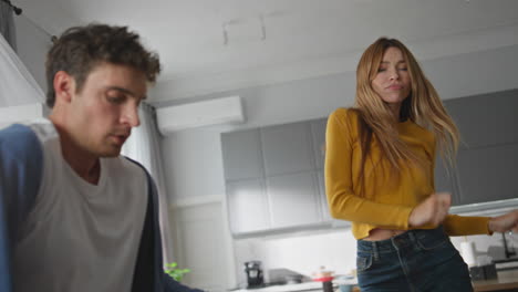 carefree woman dancing hands enjoying weekend at home closeup. couple having fun