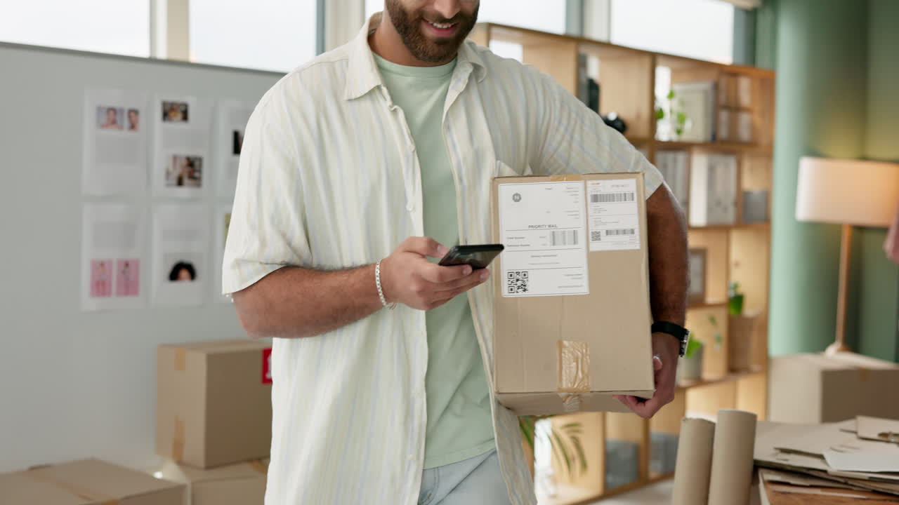 Man scanning package with mobile phone