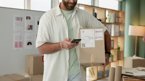 man scanning package with mobile phone