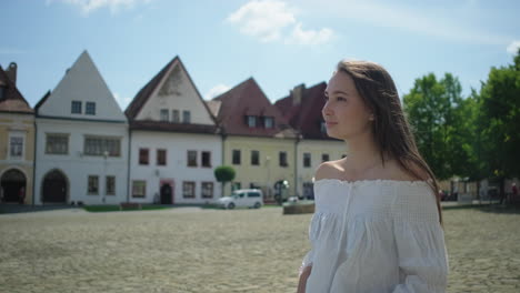 young woman in a european city square