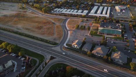 Drone-video-of-cars-driving-on-highway-surrounded-by-fall-trees