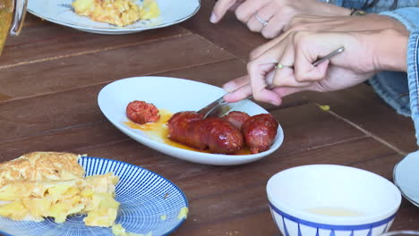 eating spanish tortilla española and chorizo