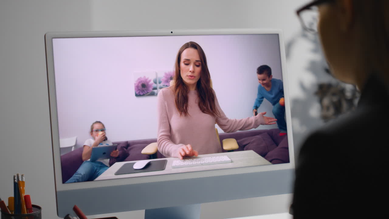 Freelancer calling online meeting with nervous colleague at home office close up