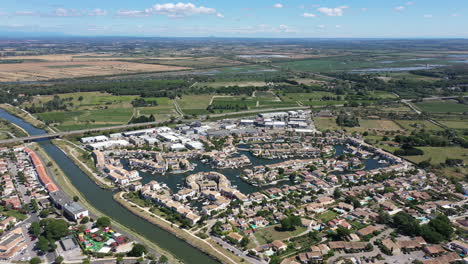 aigues-mortes marina with houses aerial view sunny day near canal du rhone