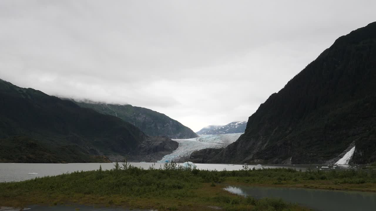 Mendenhall Glacier and Lake and Nugget Falls in a cloudy day, summertime in Alaska
