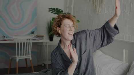 woman dancing in her bedroom