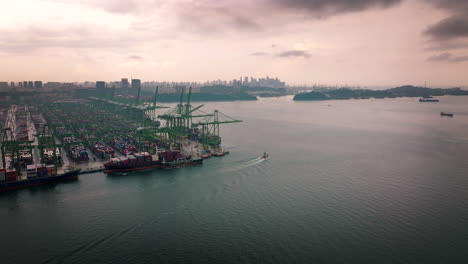 singapore commercial port and logistic area with city in background, asia