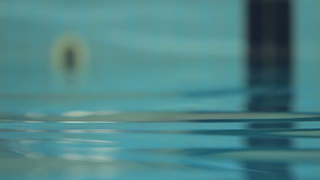 water surface in swimming pool. water background