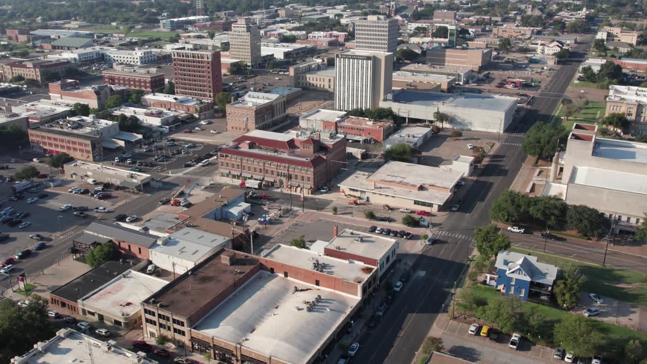 4K right pan drone footage of downtown Waco, Texas, showcasing city buildings, streets, and skyline architecture with smooth cinematic aerial motion on a clear day