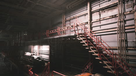 a dark and industrial staircase in a ship