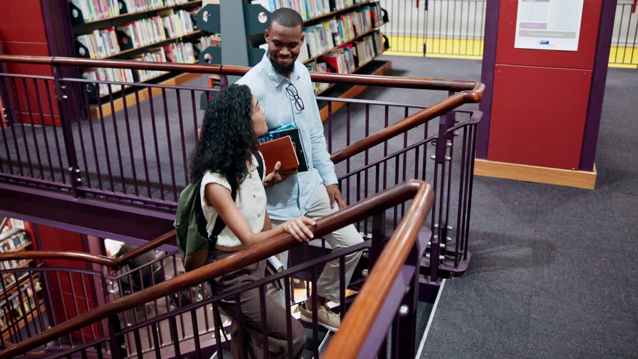 Students Walking Upstairs in a Library