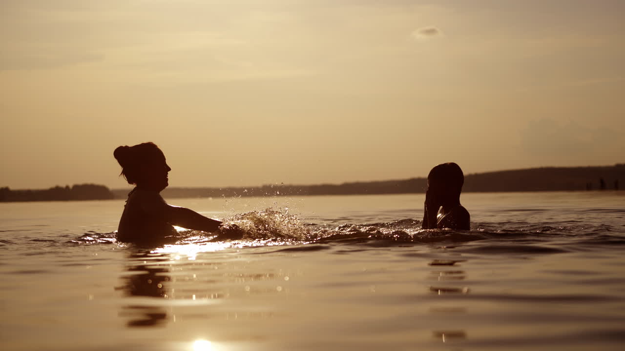People having fun in river. Little kid play in water and making splash