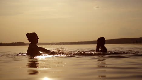 people having fun in river. little kid play in water and making splash