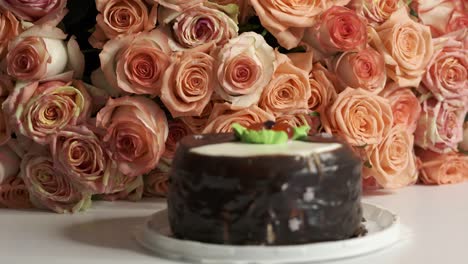 dolly: extra large bouquet of pink roses and chocolate birthday cake