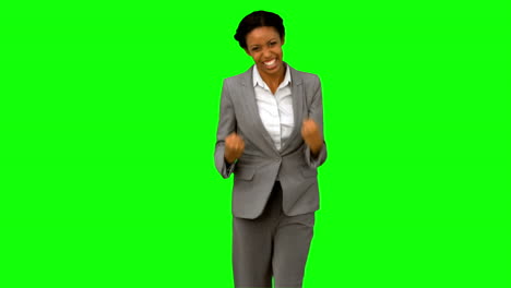 Attractive-businesswoman-gesturing-on-green-screen-