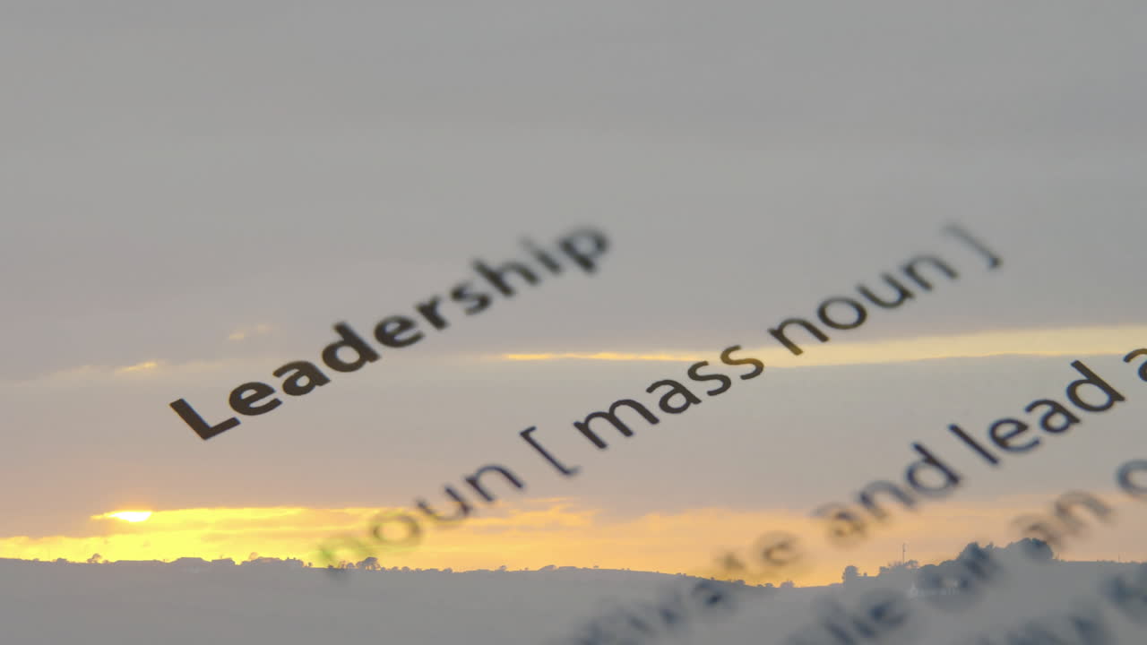Animated leadership definition over sunset landscape