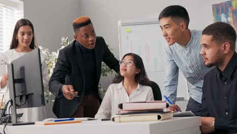 employees of corporation spend morning working hard on new project, they stare at computer monitor, take notes, collaboration, company atmosphere, successful people, business, brainstorming