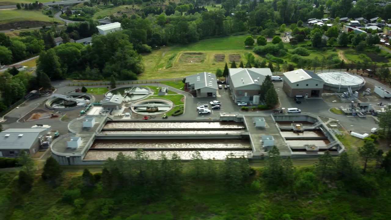 USA, OR, Ashland, WWTP, 45426 - Wastewater Treatment Plant in the North of Ashland. Flying North parallel to the plant.