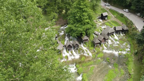 aerial fly-over scenic watermills of jajce , bosnia