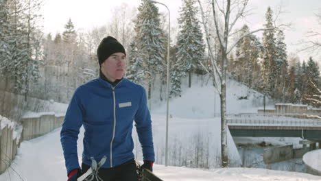 man cross-country skiing in a snowy landscape