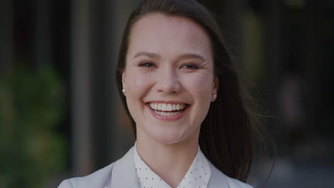 portrait beautiful business woman smiling outdiirs in city happy about success in life