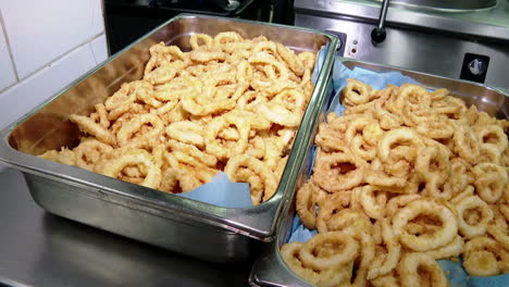 fried seafood and croquettes in commercial kitchen