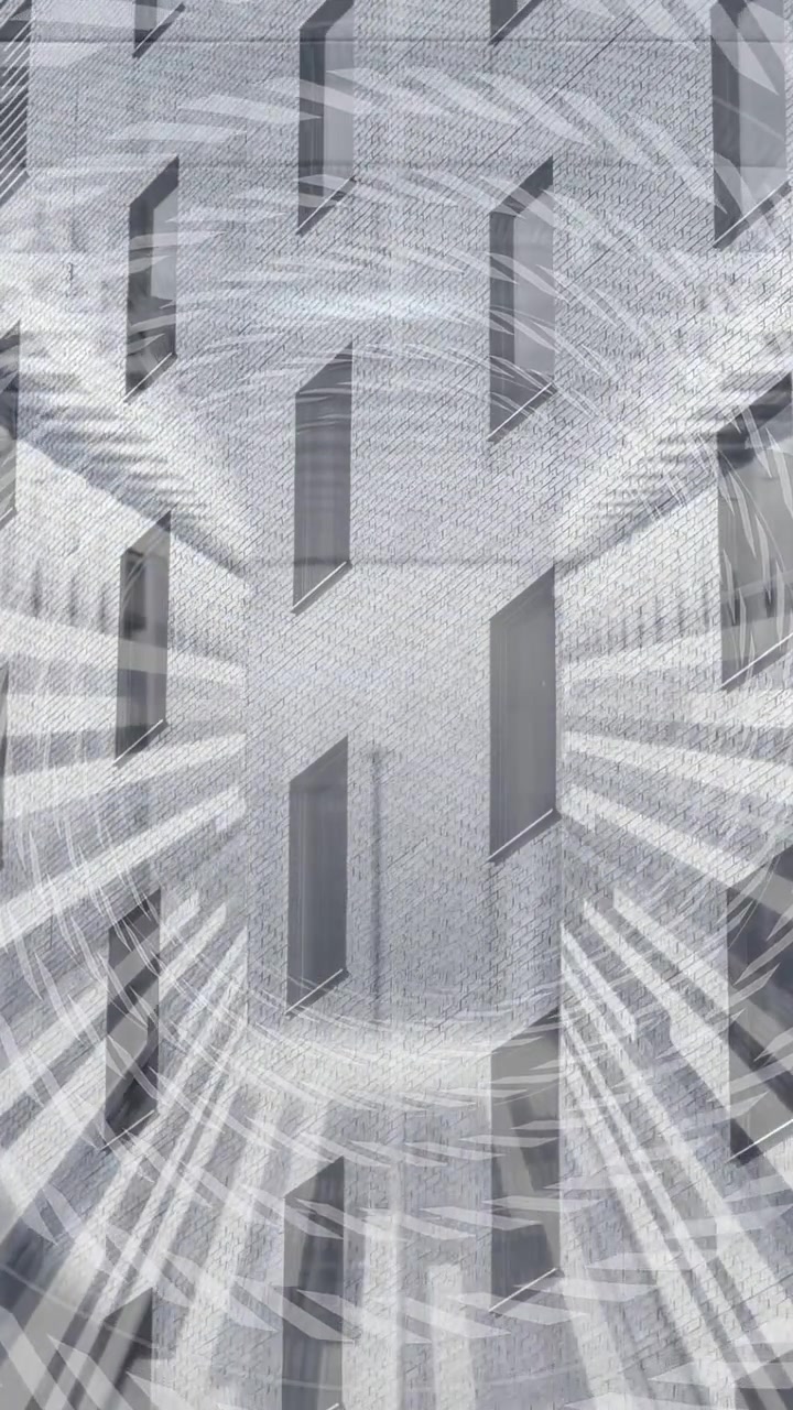 Video vertical: Pared de ladrillo estática mientras aparece un vórtice, con rayos pulsantes que se extienden para el diseño.