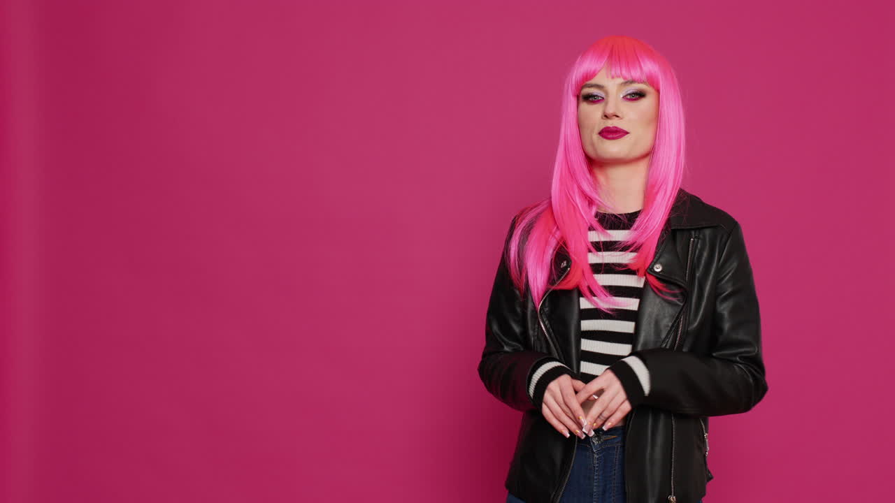 Happy confident girl with leather jacket waving on online video call