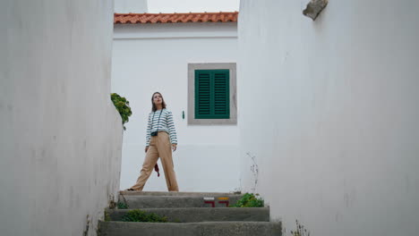 girl exploring old town on european trip vertical. carefree tourist enjoy houses