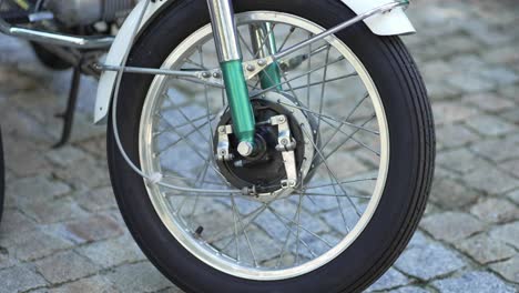 classic motorcycle front wheel and brake detail - close up