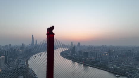 drone aerial view of sunset and the landmark bridge in shanghai china