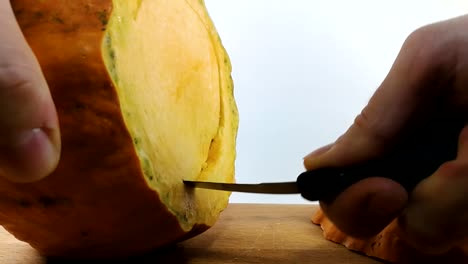 cutting a pumpkin